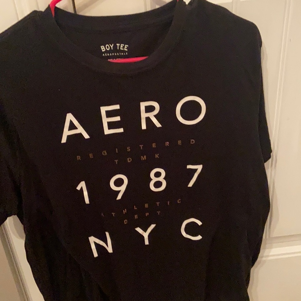 A black Aeropostale shirt fits loose and hasn’t been worn much.